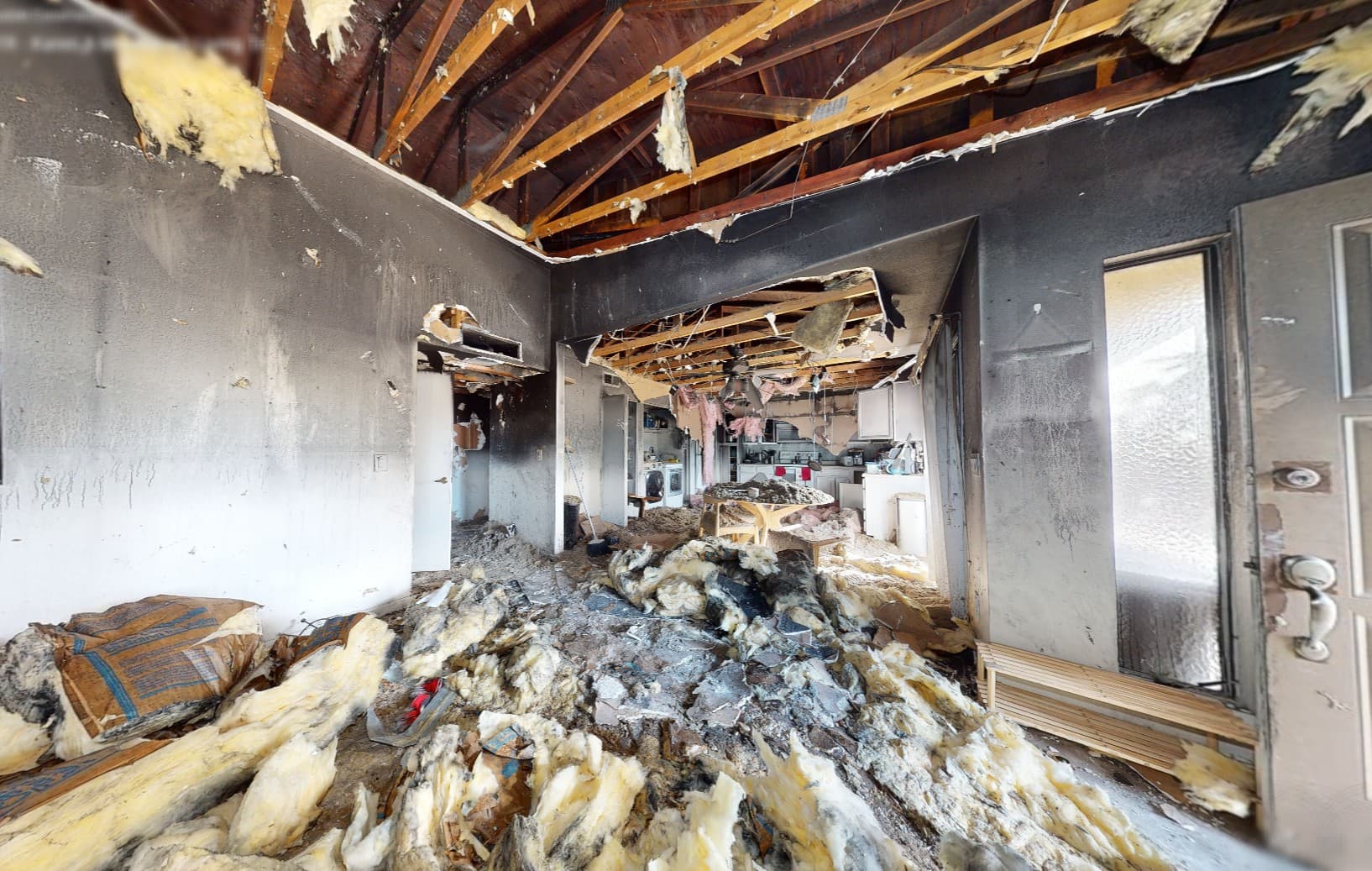Home before fire restoration — severe structural and smoke damage